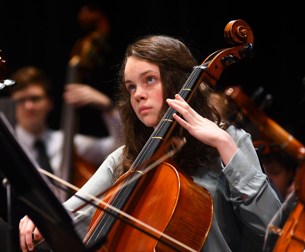 Rebecca Robuck watches the Honors Orchestra conductor